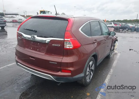 2015 Honda Cr-V Touring z USA, uszkodzony, nr VIN 5J6RM4H96FL120845